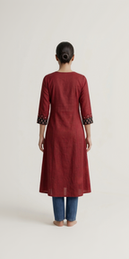 Anvita Rust Red Cotton-Linen Kurta – Black Geometric Embroidery – Elegant Round Neck Daily Wear for Women